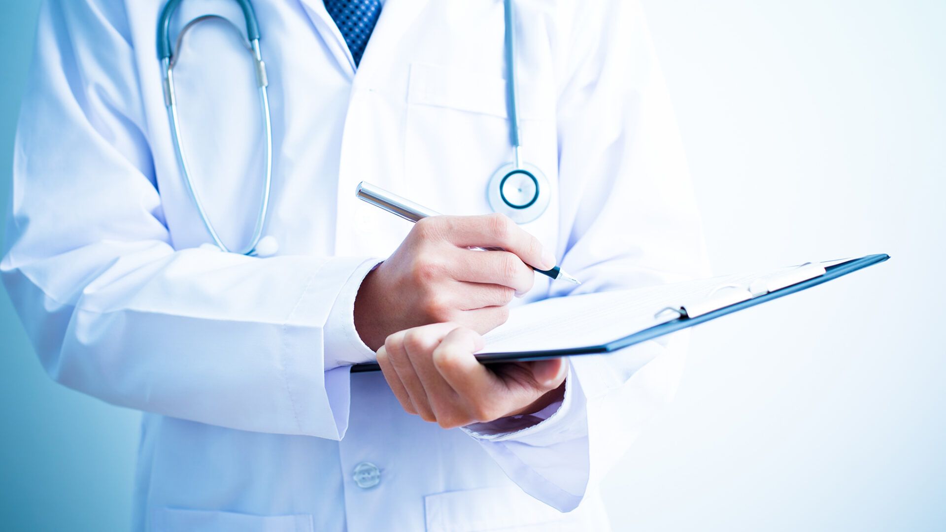 doctor holding pen paper